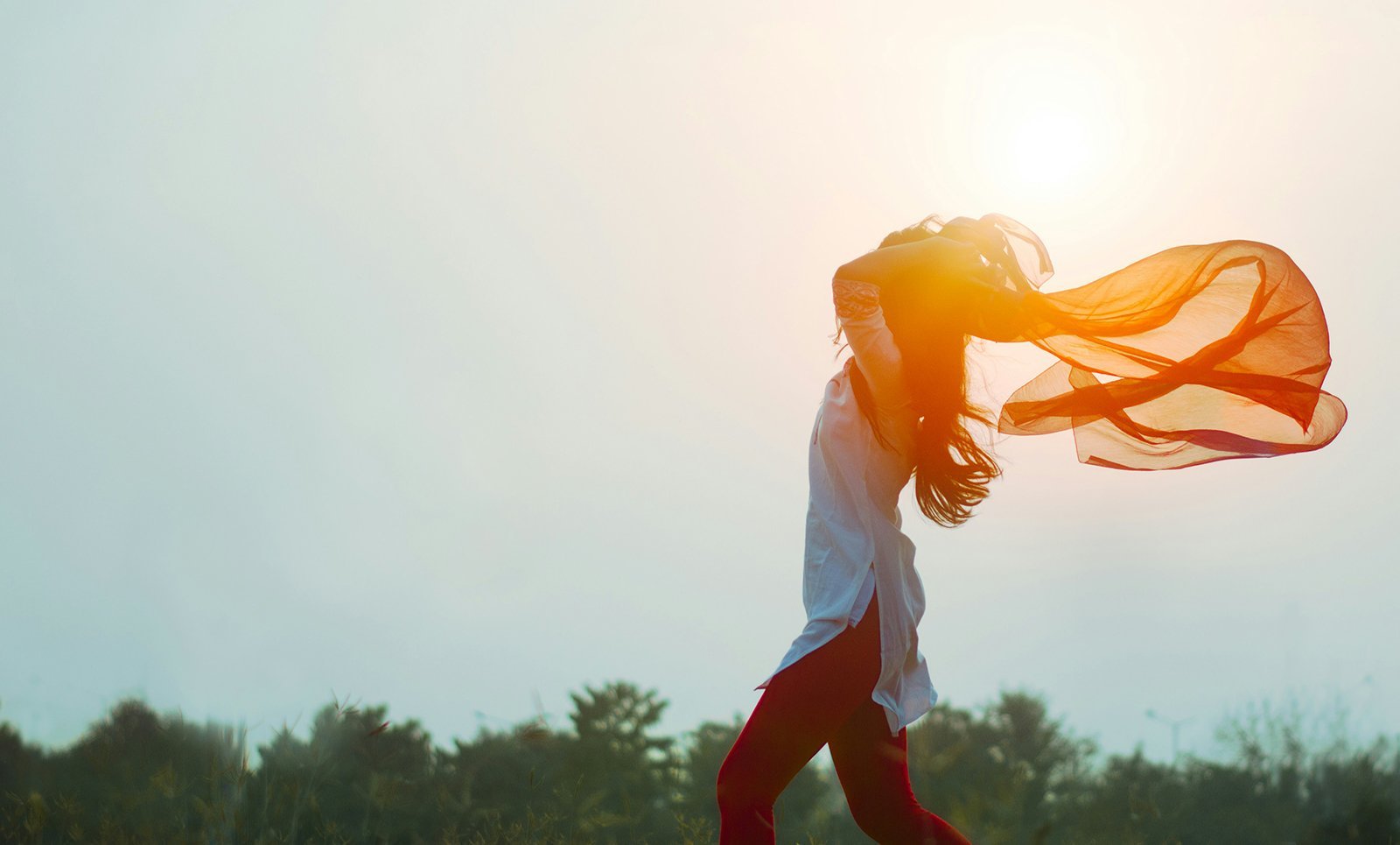 healthy woman in front of the sun