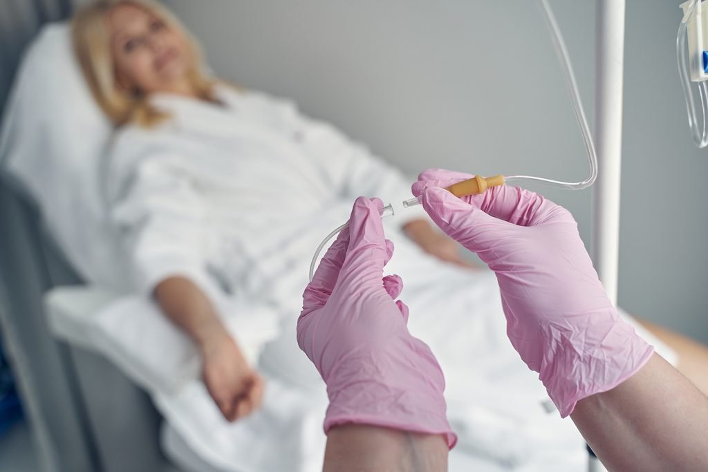 woman receiving IV therapy