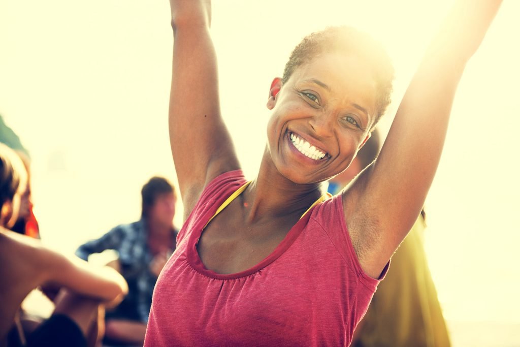 happy and healthy woman after completing hormone replacement therapy